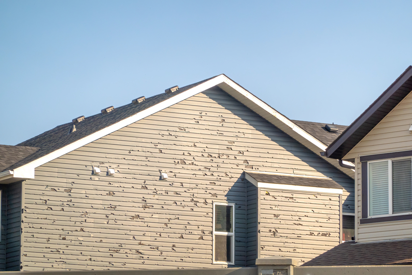 hail-damage-on-vinyl siding